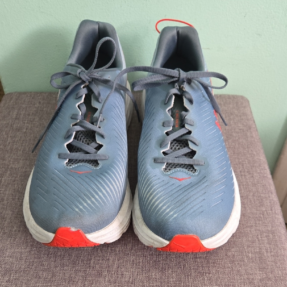 Men's Hoka One One Gray Sneakers with White and Orange/Red Details.